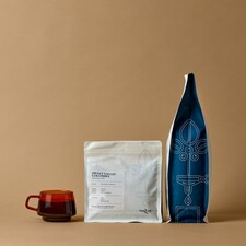 Sweet Valley Colombia coffee bag with a cup of coffee