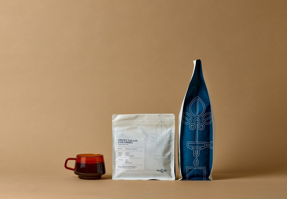 Sweet Valley Colombia coffee bag with a cup of coffee